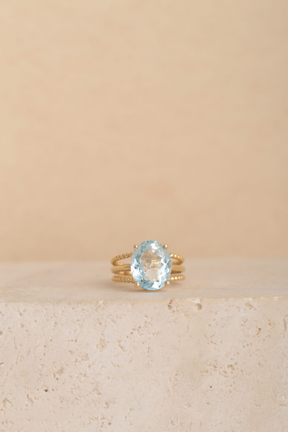 Oval aquamarine ring in 18-karat yellow gold set with a Aquamarine gemstone. All our jewellery is handmade by jewellery designer Pascale Masselis.