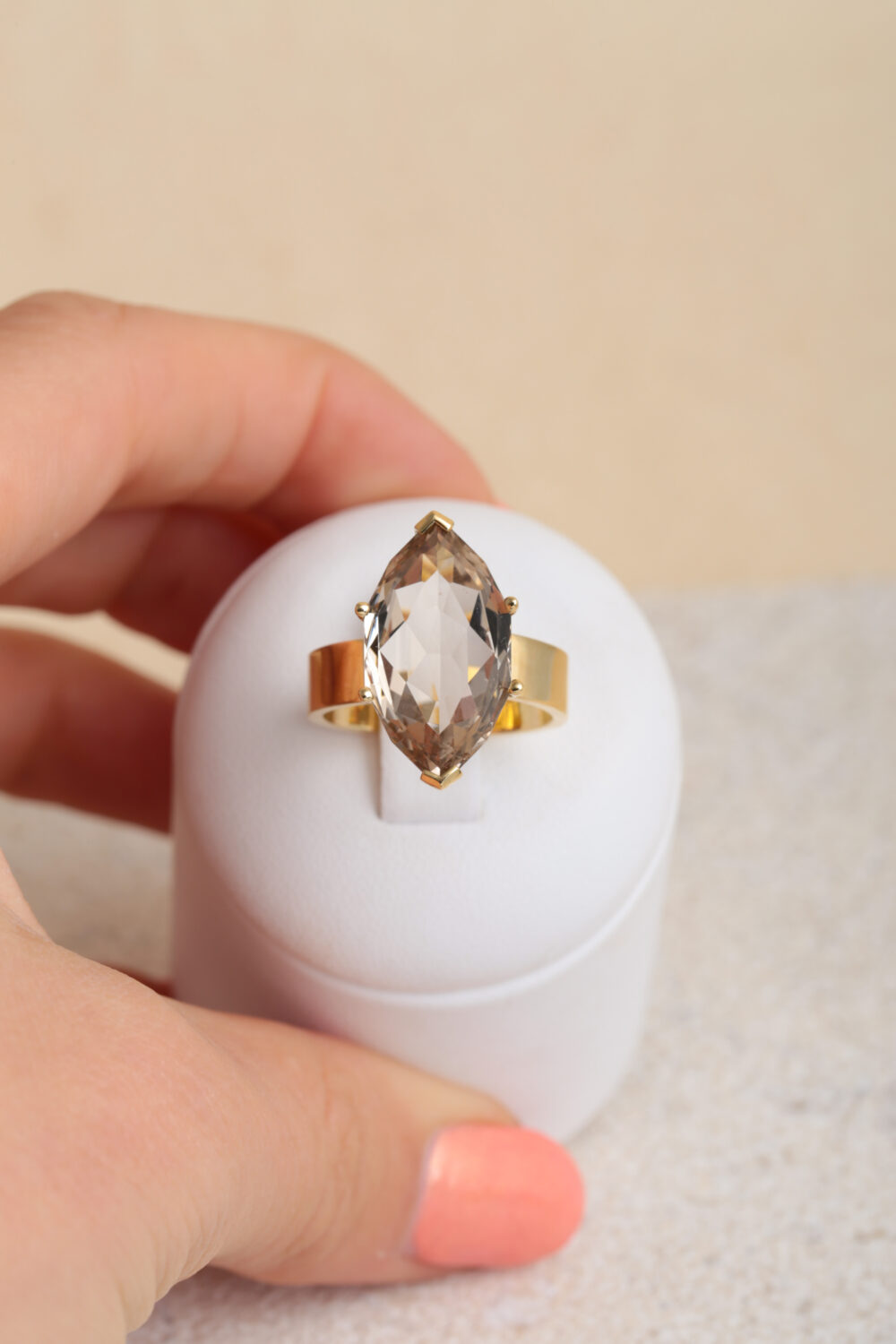 18-karat yellow gold ring set with a marquise-cut smoky quartz gemstone.