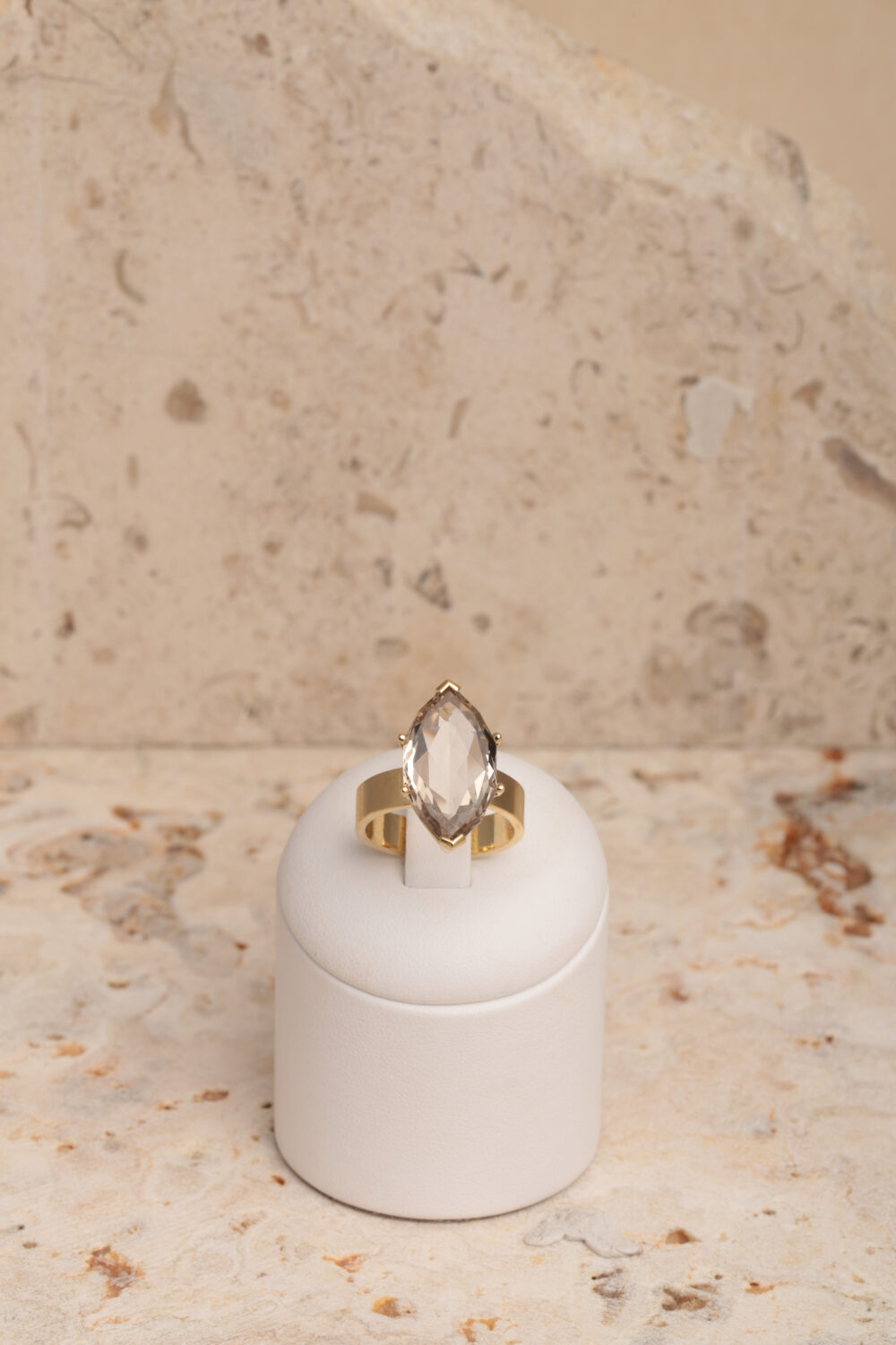 18-karat yellow gold ring set with a marquise-cut smoky quartz gemstone.