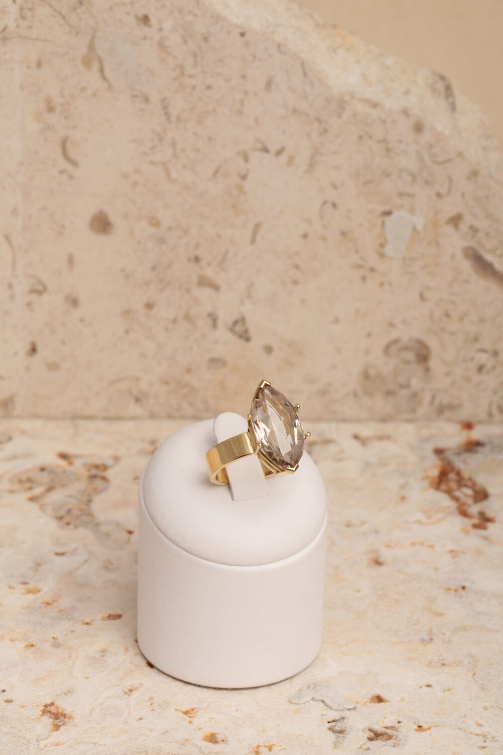 18-karat yellow gold ring set with a marquise-cut smoky quartz gemstone.