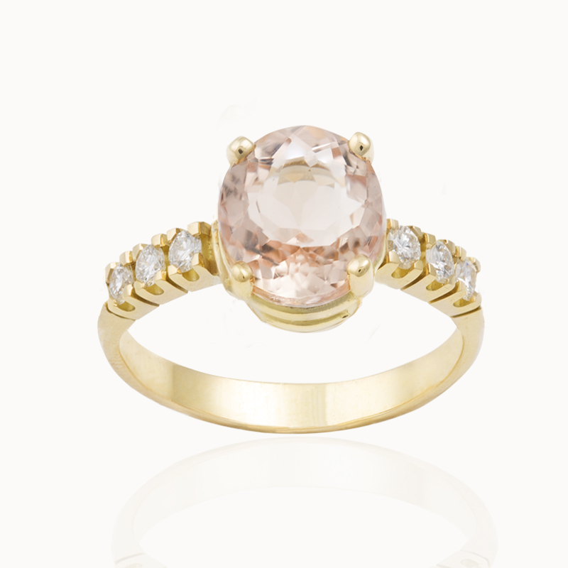 Morganite ring in 18-karat yellow gold ring with 6 brilliant cut diamonds.