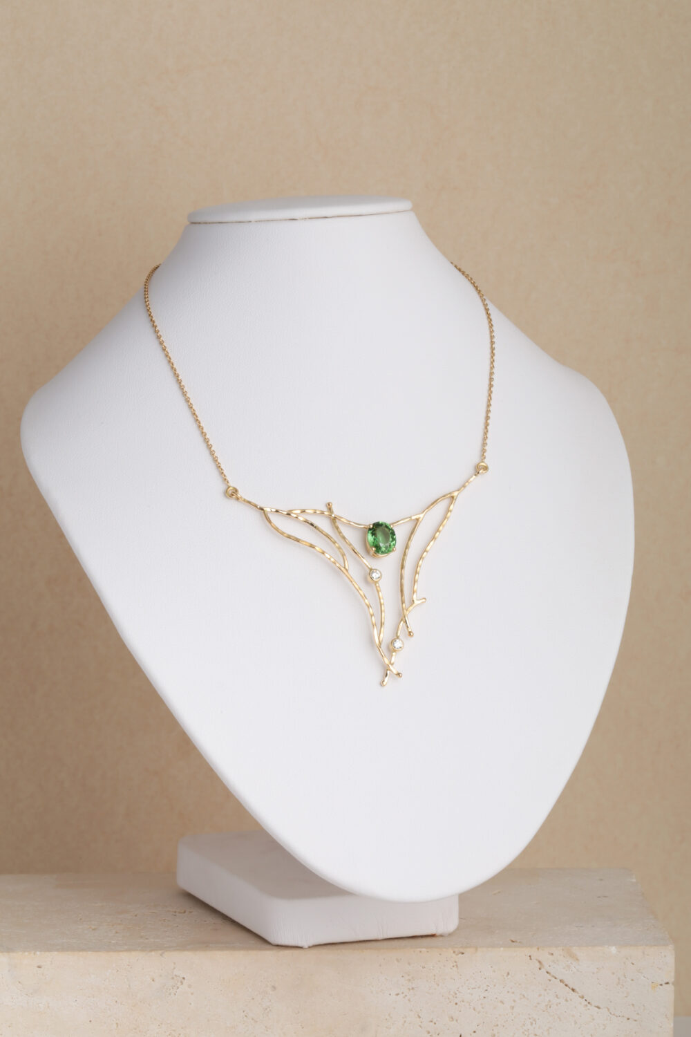 Diamond and Tourmaline necklace crafted from 18- karat gold set with an oval Tourmaline gemstone and diamonds by jewellery designer Pascale Masselis