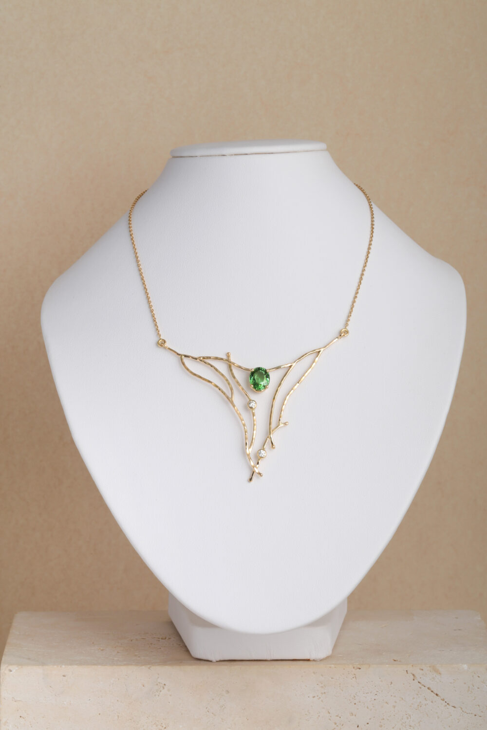 Diamond and Tourmaline necklace crafted from 18- karat gold set with an oval Tourmaline gemstone and diamonds by jewellery designer Pascale Masselis