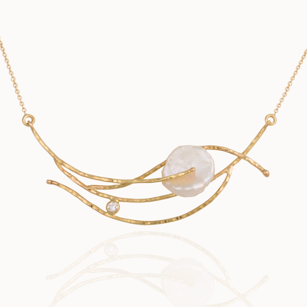 Necklace crafted from 18-karat yellow gold set with a brilliant cut diamond and a baroque, natural pearl gemstone.