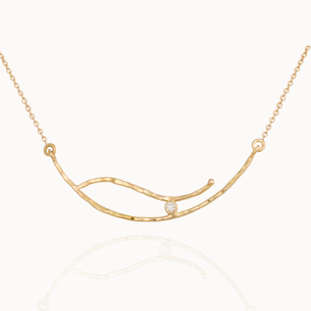 Necklace crafted from 18-karat gold set with a brilliant cut diamond.