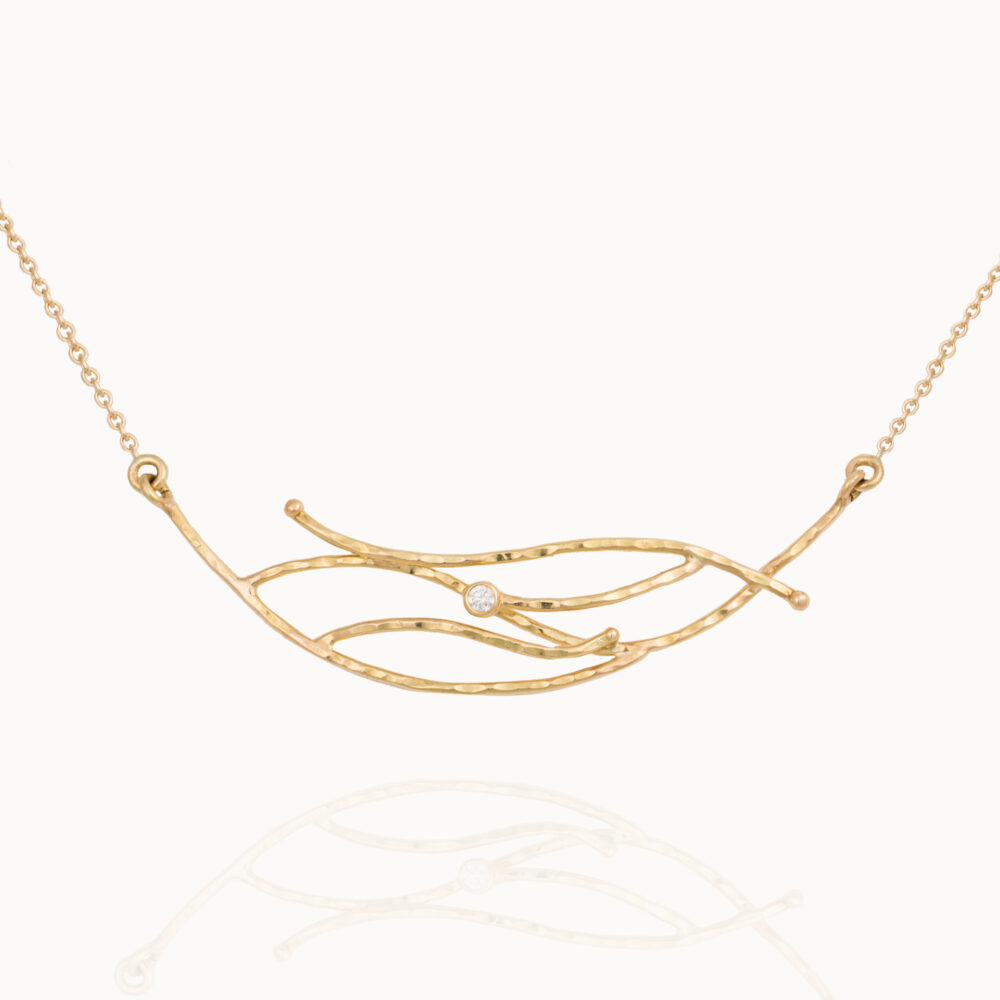 Organic shaped Diamond necklace crafted from 18-karat gold set with a brilliant cut diamond handmade by jewellery designer Pascale Masselis