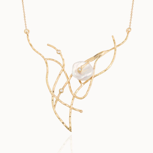 Necklace crafted from 18-karat gold set with three brilliant cut diamonds for a total of 0,15 ct and a baroque, natural pearl gemstone.