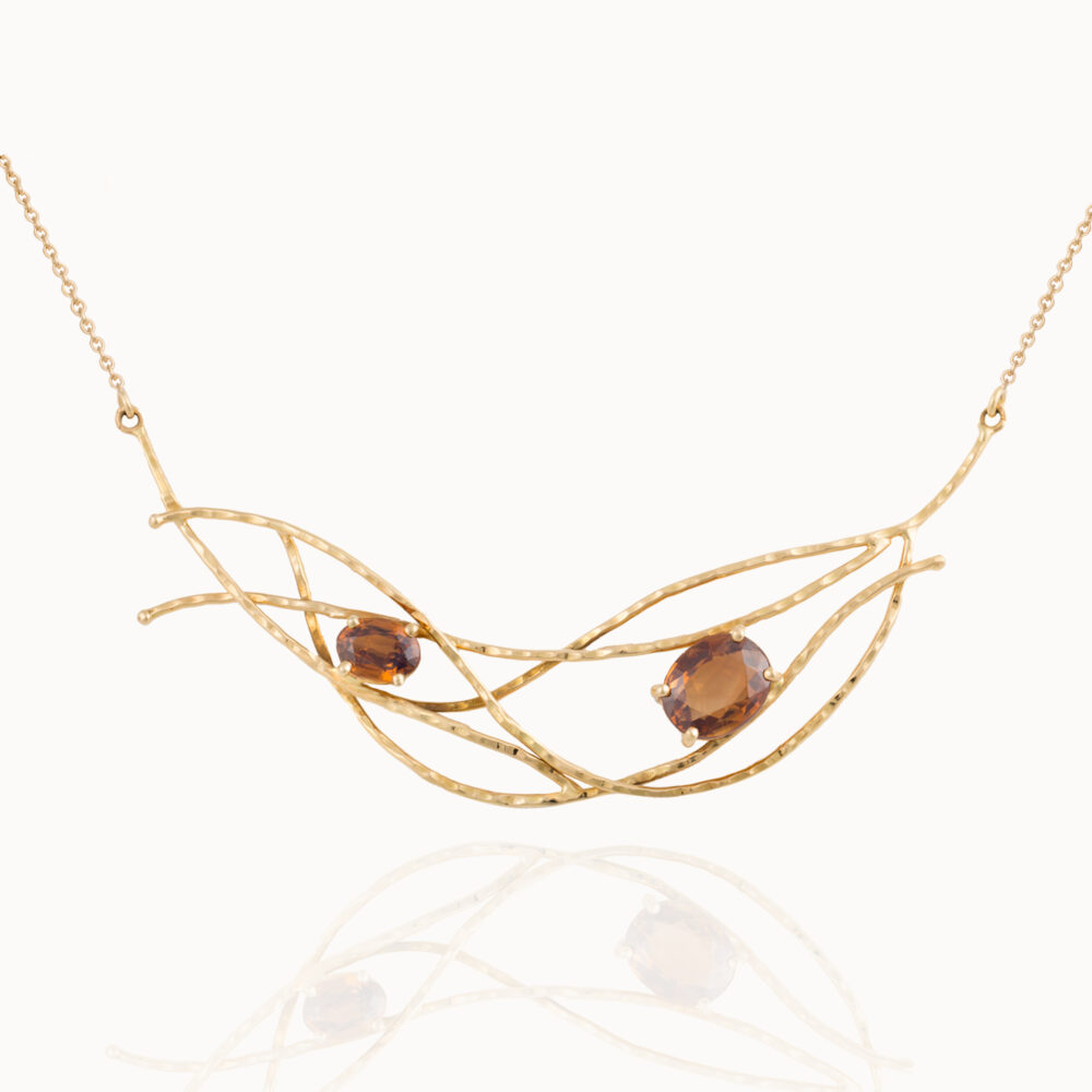 Necklace crafted from 18-karat gold set with two oval cut Zircon gemstones handmade by jewellery designer Pascale Masselis.