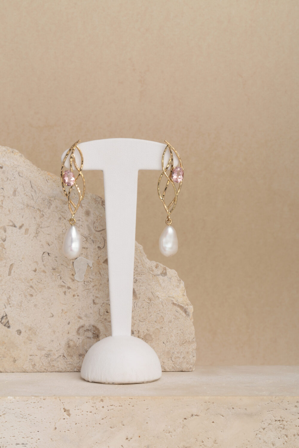 Morganite and Pearl earrings crafted from 18-karat yellow gold set with two oval cut morganite gemstones and two baroque drop-shaped pearls.