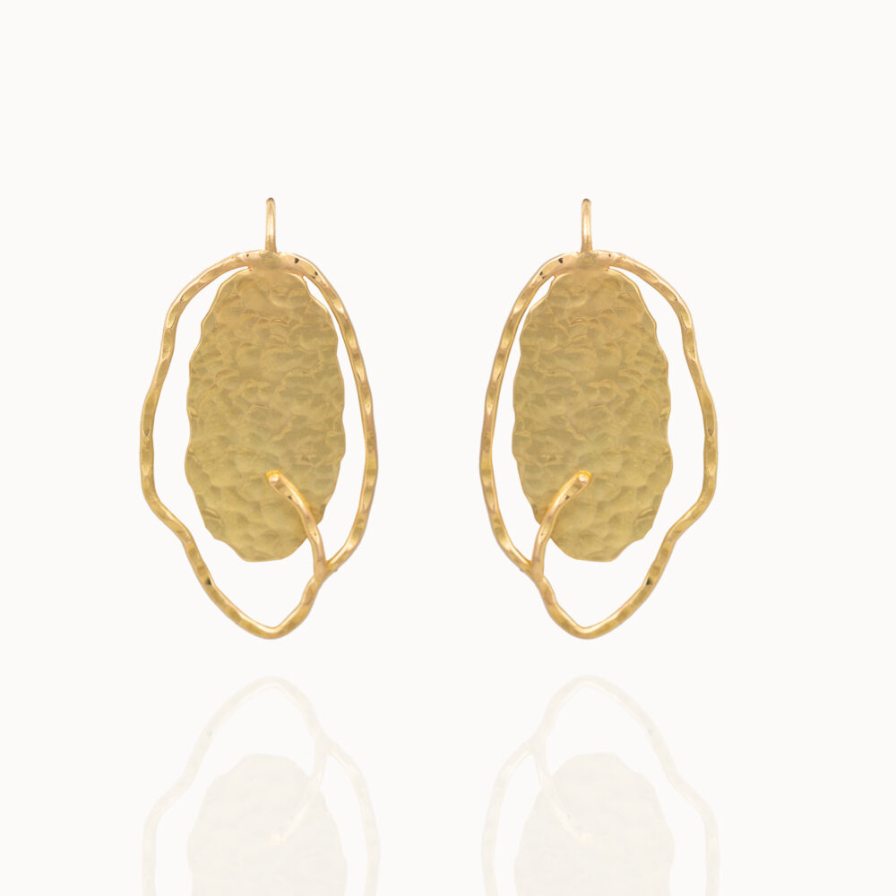 Hammered gold earrings made from 18 karat gold by Belgian jewellery designer Pascale Masselis in her Antwerp based Atelier.