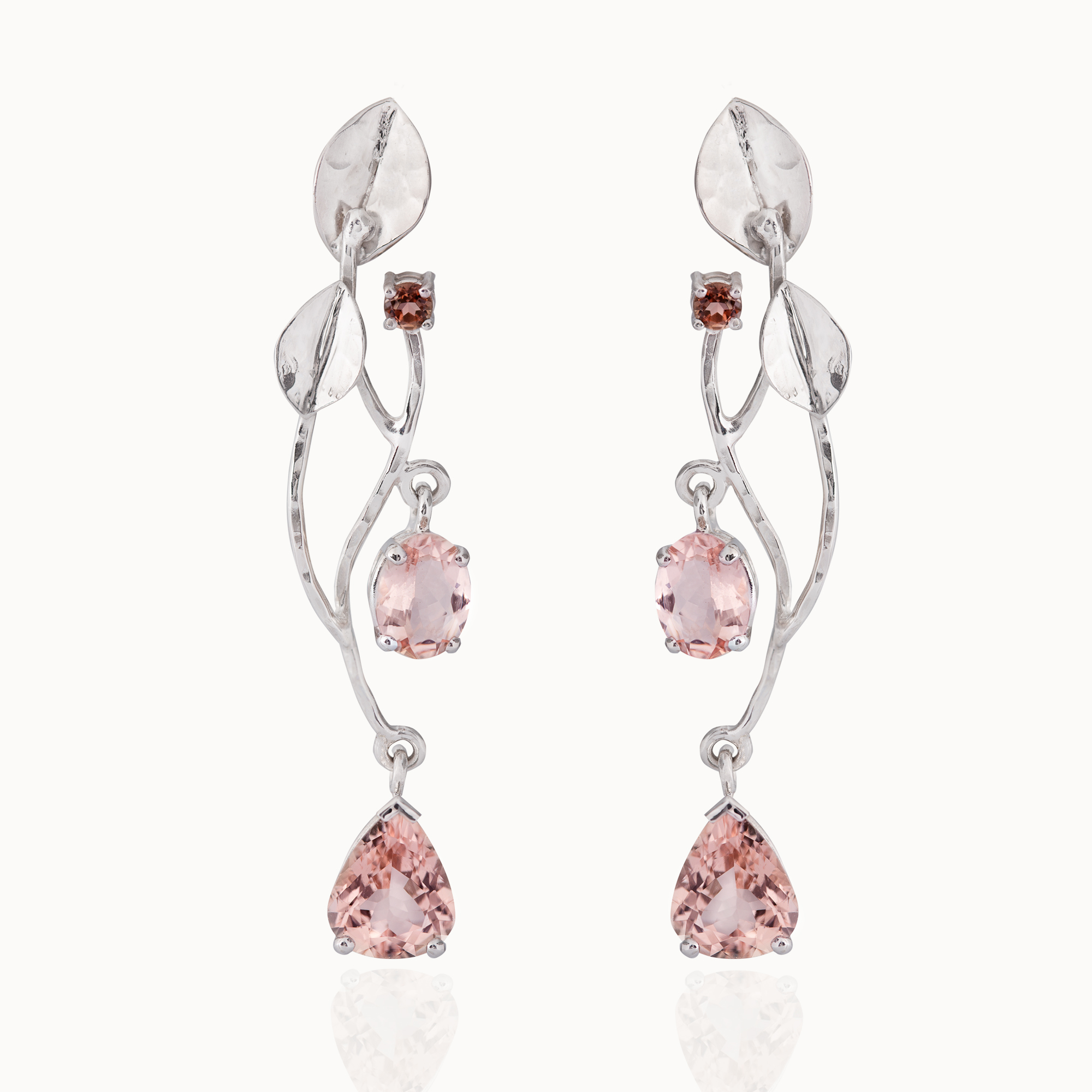 Crafted from 18-karat white gold set with two round, two oval cut and two pear cut morganite gemstones. Handmade by designer Pascale Masselis.